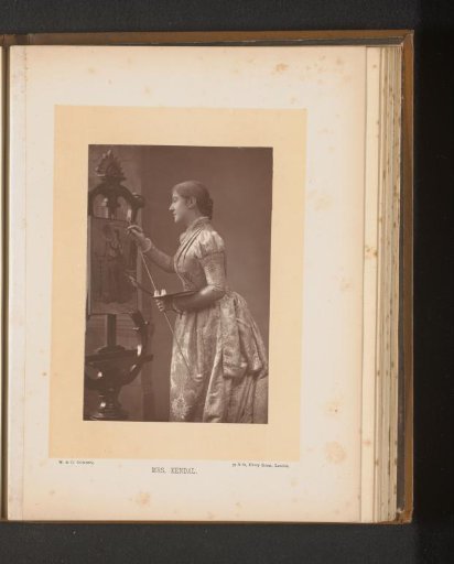 Portrait of Madge Kendal behind an easel