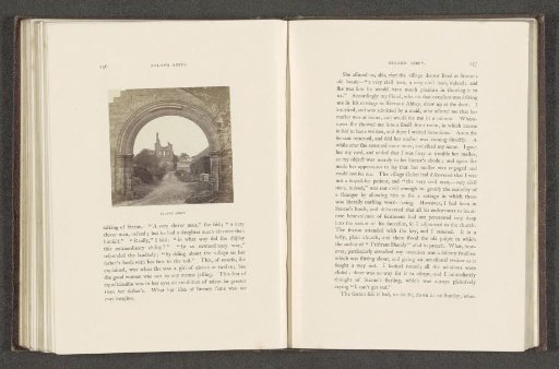 View of the ruins of Byland Abbey through a gate
