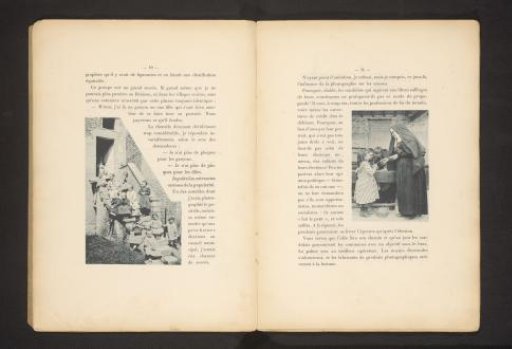 A nun giving something to a girl, with two girls looking at a table behind them
