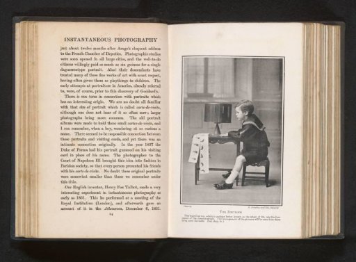 Portrait of a boy sitting behind a zoetrope
