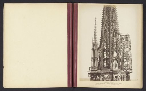 Copper spire for the roof rider of Notre-Dame in Rouen with workers inside