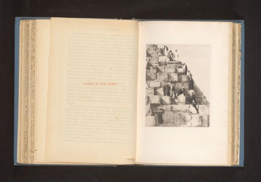Men climbing the Pyramid of Cheops at Giza