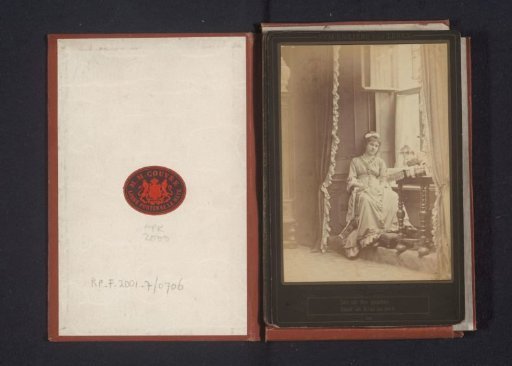 Portrait of an unknown woman seated in a window frame