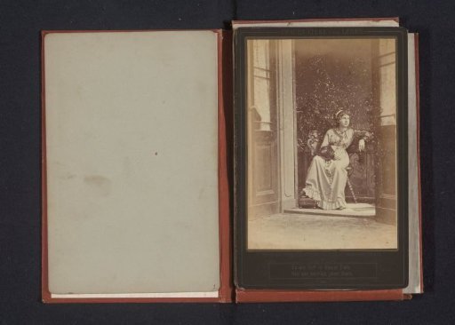 Portrait of an unknown woman seated on a balcony