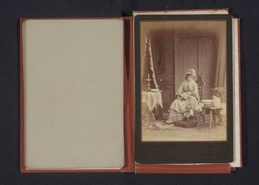 Portrait of an unknown seated woman with a baby in her arms