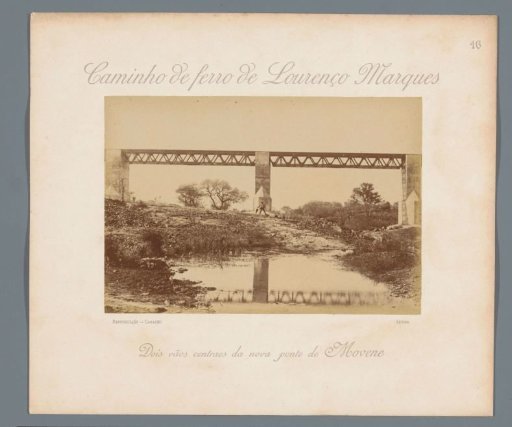 View of a railway bridge over the Rio Movene in Mozambique with a man in front