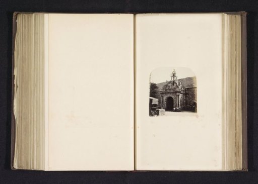 Well and south portal of a church in Carnac