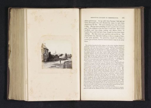Man on a road in Baud with the St. Pierre church in the background
