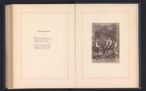 Three children in costume before a mountain landscape