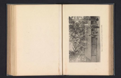 Four inhabitants of Wangata in front of a wooden house