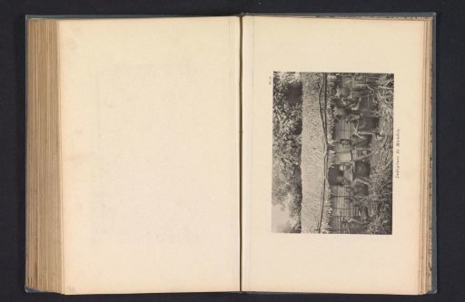Inhabitants in front of a house at Mumbia
