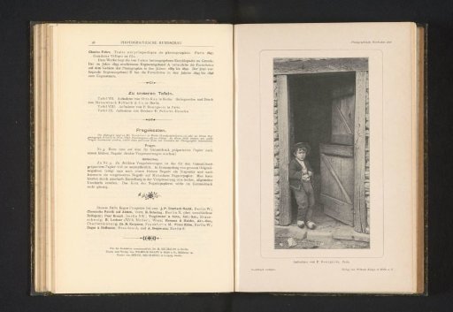Boy in Clogs in a Doorway