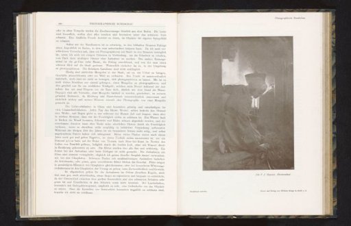 An unknown woman lighting the fire in the kitchen