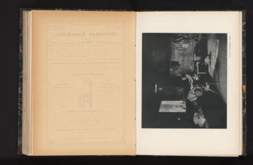 View of two unknown men in a workshop