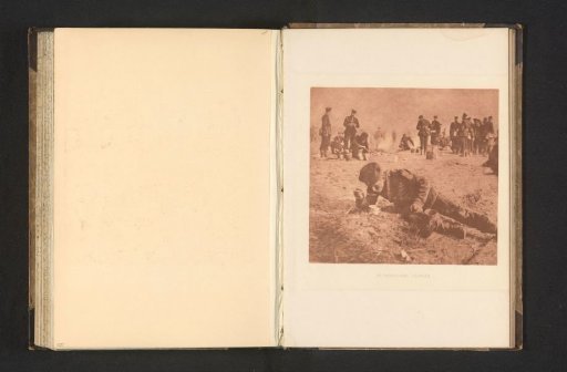Half-reclining soldier eating