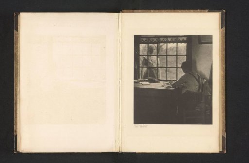 Woman working at a table and another woman looking through the window