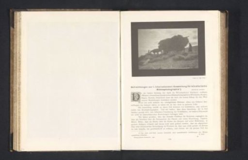 Horse and hay wagon with a farmer and his wife
