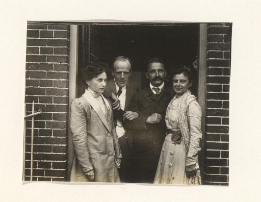 Men and women at a doorway