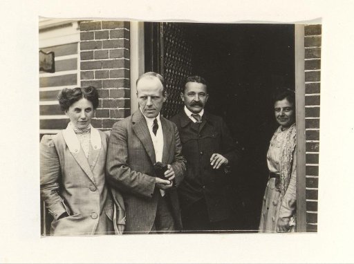 Men and women at a doorway