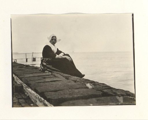 Woman in traditional dress by the water