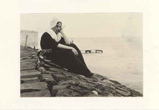 Woman in traditional dress by the water