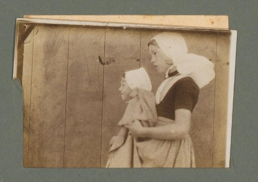 Portrait of two girls in costume, seen from the side