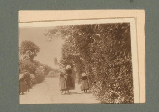Family in traditional dress, seen from behind