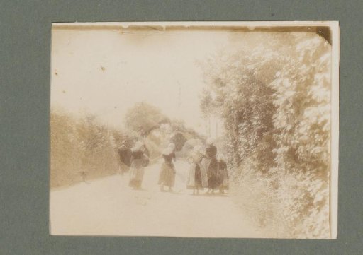 Family in traditional dress, seen from behind