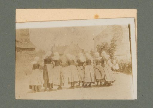 Eight girls in costume, seen from behind