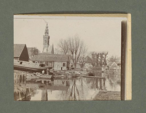 Village view with a waterway and view of the Speeltoren in Edam