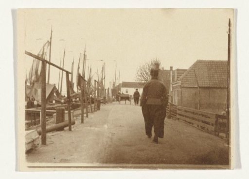Men in traditional dress along the harbor in Volendam