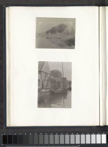 View of houses along a canal under trees, probably near Volendam
