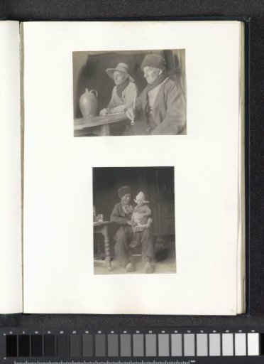 Portrait of a man with a child on his lap, both in Volendam costume