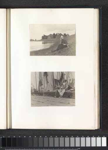 Girl in Volendam costume sitting on a dike at (probably) the Zuiderzee