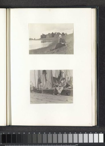 Three children in Volendam costume sitting on a quay