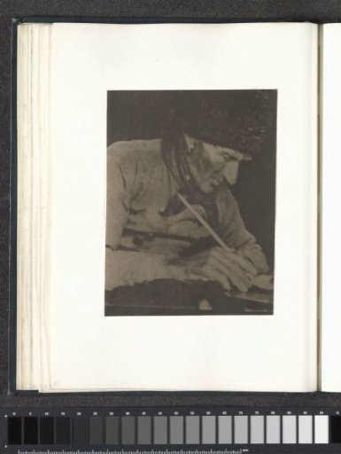 Portrait of a seated man with a cap holding a pipe, probably in Volendam