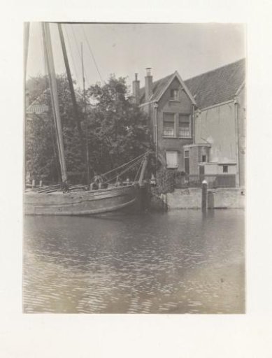 View of a quay in Dordrecht with the moored ship of O.W. de Wolf