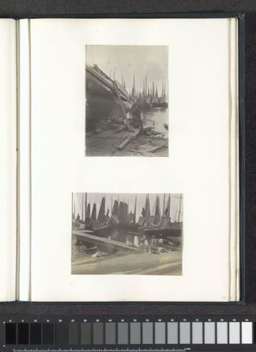 Man and two children seated at a quay, probably in Volendam