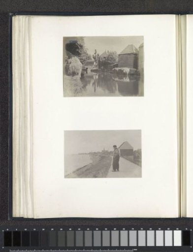 View of farmhouses along a ditch, probably in North Holland