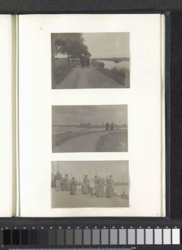 Man and woman in costumes on a dike near Volendam