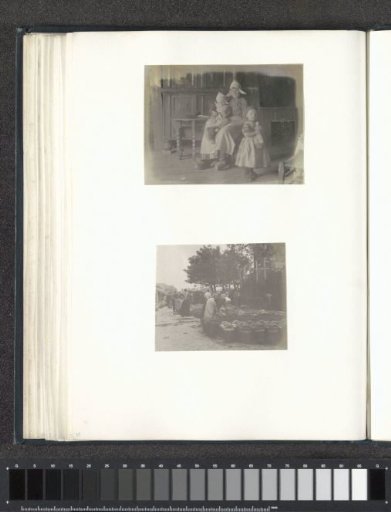Portrait of a woman with two children in Volendam costumes