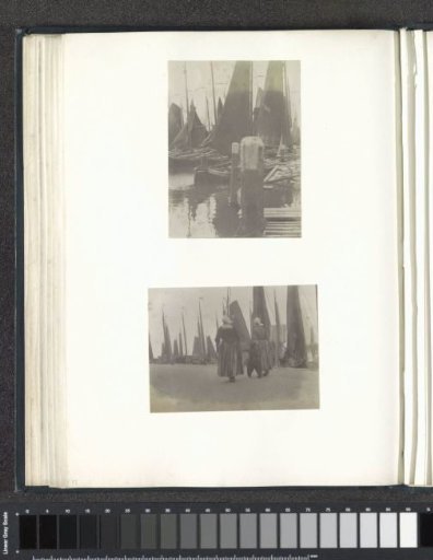Women and boy in costumes on a quay in Volendam