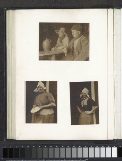 Portrait of a woman in Volendam costume, standing with a plate in her hand