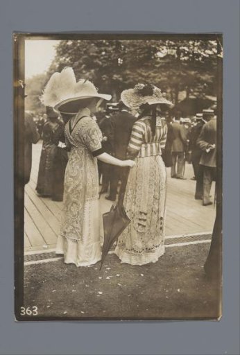 Two women in a park or on a racecourse in France