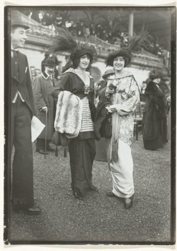 Two women among the public during horse races, Hippodrome de Longchamp in the Bois de Boulogne