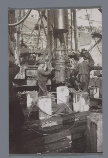 Workers at a hoist during construction work in Brussels, Belgium