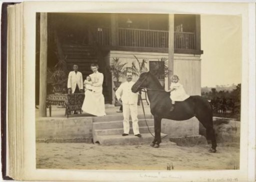 Portrait of E. Bremer with wife, children, servant, and horse in front of his house, Langkat Sumatra
