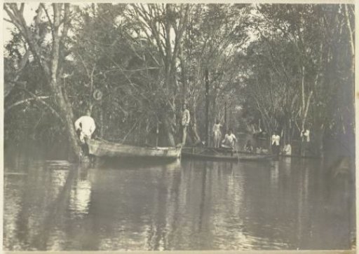 Boats navigating the flooded streets of Banjir, Langkat Sumatra