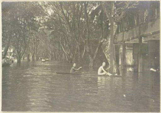 Boats navigating the flooded streets of Banjir, Langkat Sumatra