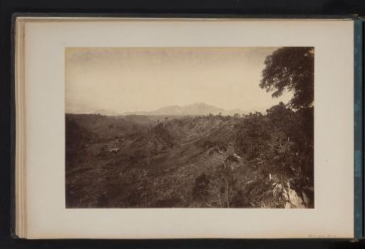 View of Mount Sinabourg in Upper Deli, Sumatra, with cleared primeval forest in the foreground